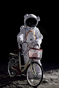 太空中手扶自行车的宇航员背景图片