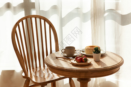 木制家装圆桌上的下午茶背景