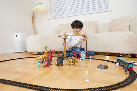 儿童节玩乐场景在客厅玩乐高的小男孩背景