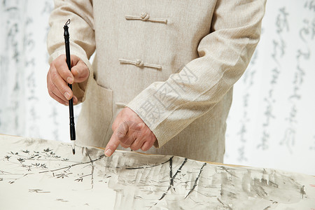 中国风中年男性写书法特写背景图片