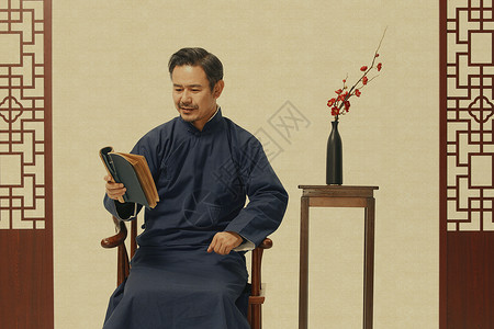 中年国风长袍男性看书背景图片
