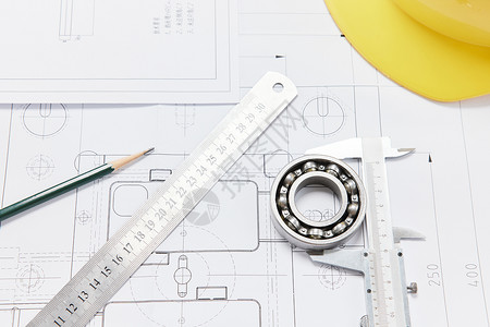 黄色圆规建筑工程设计图纸安全帽工具背景