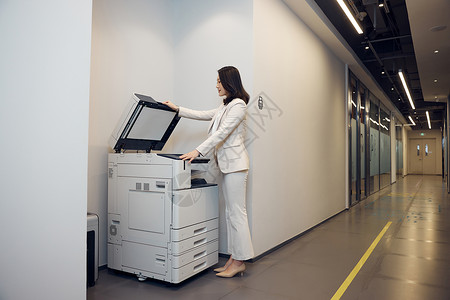 高管设备商务女白领使用打印机背景