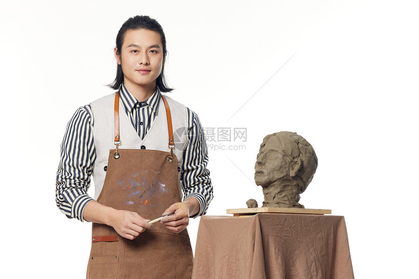青年男性雕塑家形象图片