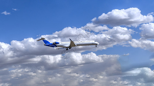 蓝天白云下飞行的民航客机飞机图片