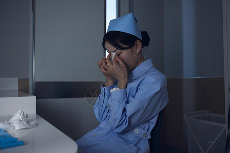 医院休息室休息室表情难过哭泣的护士背景