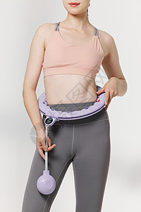 健身女性使用便携呼啦圈瘦身图片