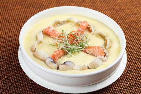 丰富中餐美食白色蛤蜊鲜虾炖水蛋背景
