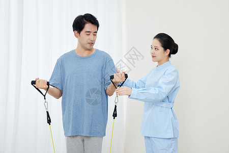 护士帮病患做拉伸复健训练背景图片