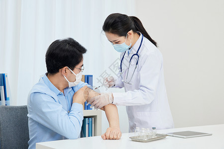 针头扎针打针女医生给患者打疫苗背景