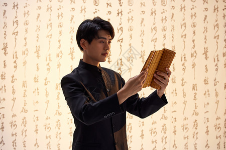 中式书框素材穿中山装的国风少年阅读竹筒书背景