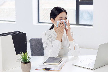 商务女白领正确佩戴口罩背景图片