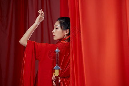 古风女侠素材古风汉服女子手拿剑柄背景