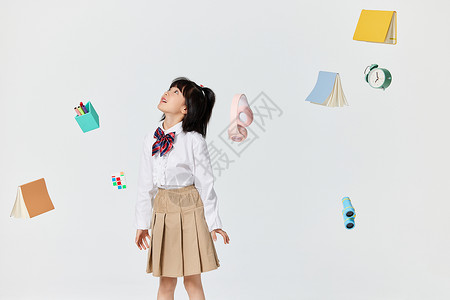 漂浮的文具与小女孩背景图片