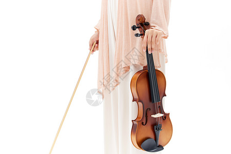 青年女性手拿小提琴特写背景图片