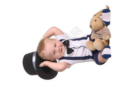 带领结的男婴魔术师和玩具软兔头戴银丝带图片