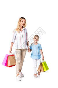 母亲和女儿用白色孤立的购物图片