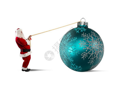 圣诞老人带着闪亮的大圣诞球图片