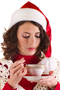穿着圣诞老人服装的年轻美女带着白色背图片