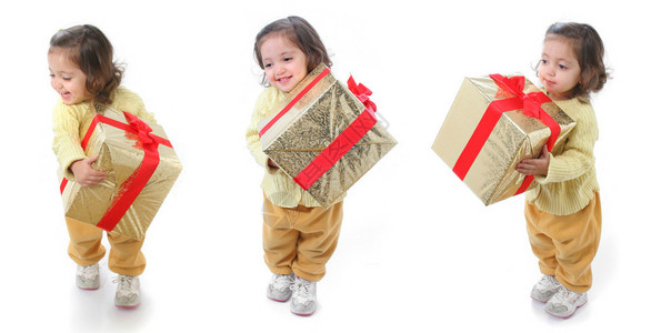 可爱的小女孩有圣诞礼物三图片
