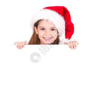 带着圣诞老人帽子的快乐女孩图片