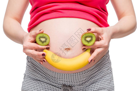 概念照片孕妇腹部背景上的眼睛图片