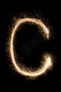 生如夏花艺术字英文大字母C由黑色背景上的燃烧花制成闪亮的节日派对烟花字体背景