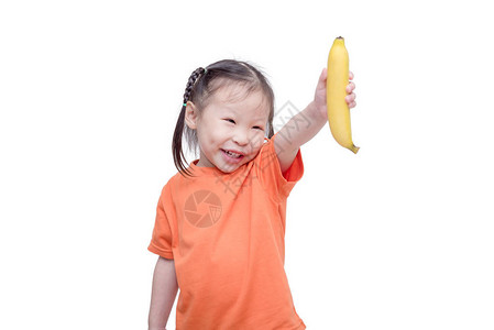 一个小女孩拿着香蕉图片