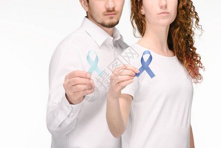 在白结肠癌概念上分离的持有不同颜色彩带的背景图片