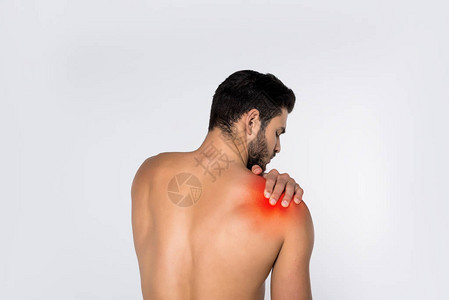 年轻不穿衣服的男人的背面肩部疼痛图片