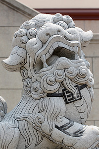 在寺庙的石狮子雕塑背景图片