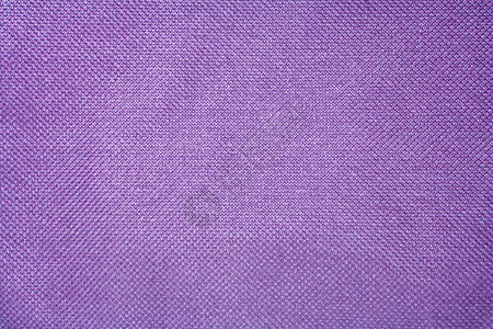 以紫色织物为背景的纹理图片