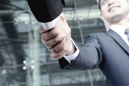 商人握手问候交易合背景图片