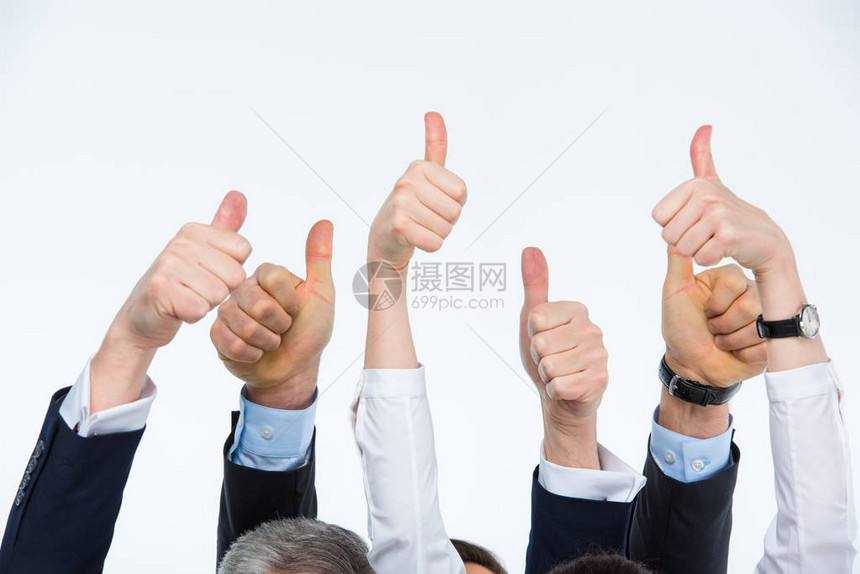 商业人士在白色上举起大拇指的图片