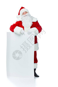 留着胡子的圣诞老人摆着空白的标语牌图片