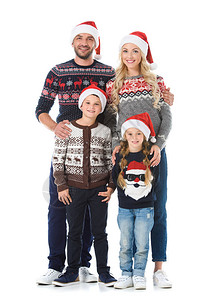 带着孩子的幸福家庭穿着圣诞毛衣和圣塔图片