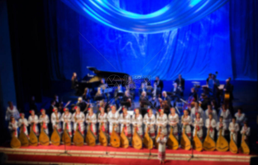 艺术家民间乐团banduristsabstract模糊图像的集合音乐家在音乐会舞台上演奏乐器设计背景模糊音乐会舞台上图片