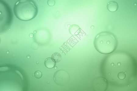 绿色背景上的肥皂泡抽象背景背景图片