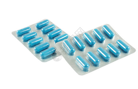 白色背景上的蓝色抗生素药丸图片