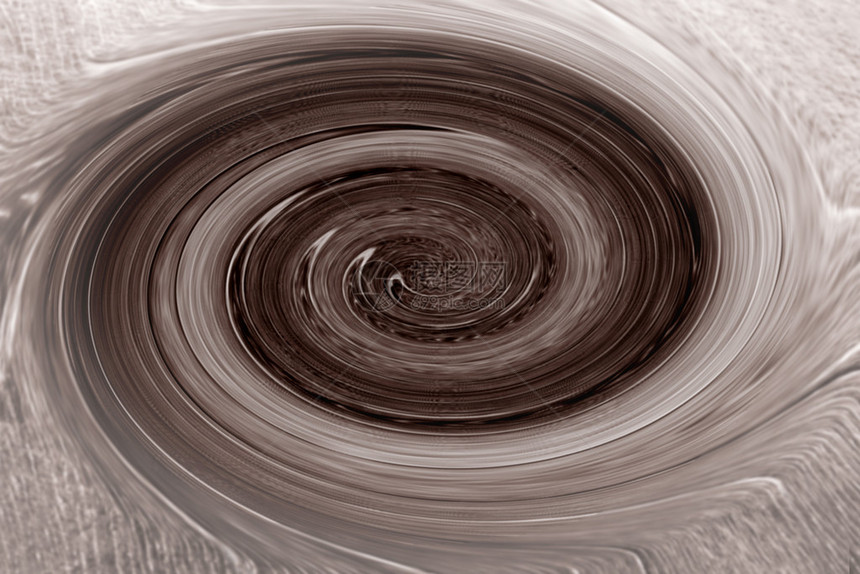 一个巧克力色的漩涡在旋转图片