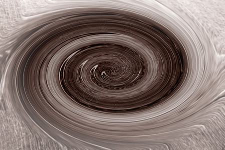 一个巧克力色的漩涡在旋转图片