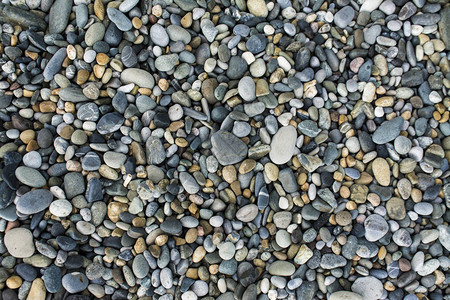 海卵石背景沙滩上的小石头图片
