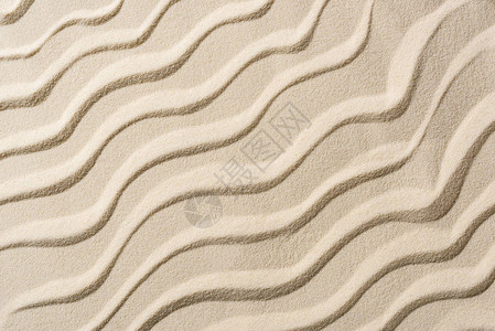 平滑波浪的蜜色沙面图片