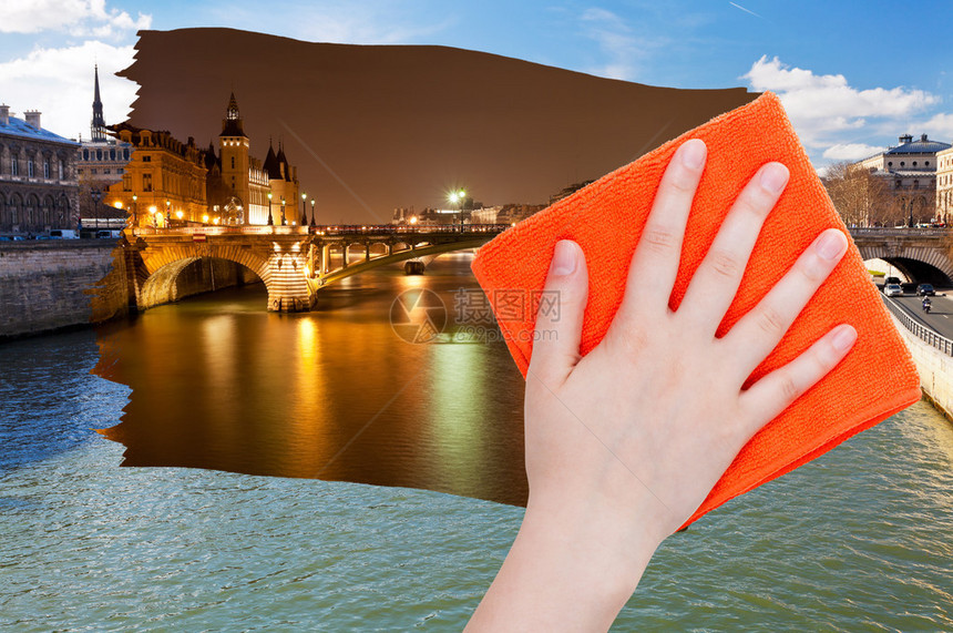 手从图象上用橙色布条删除巴黎的日景图片