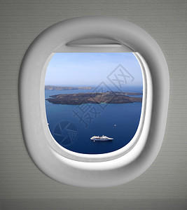 飞机靠窗座位视图与海景和岛屿图片