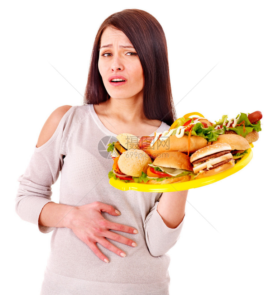 悲哀的女人吃脂肪食物后腹部疼图片