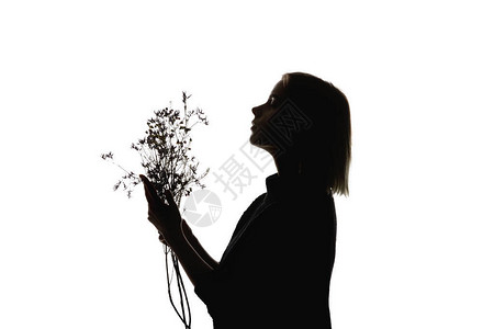 女人拿着花束被白色隔离的侧视图图片