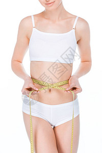 身穿白内裤的年轻女子腰部用白色隔离的胶带图片