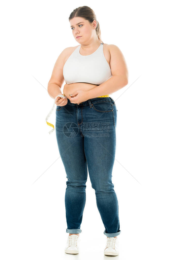 穿着腰部内裤的不满意超重妇女图片