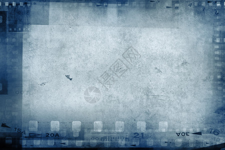 蓝色背景上的电影负帧背景图片